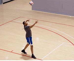 Image of Loik Makuza playing volleyball.